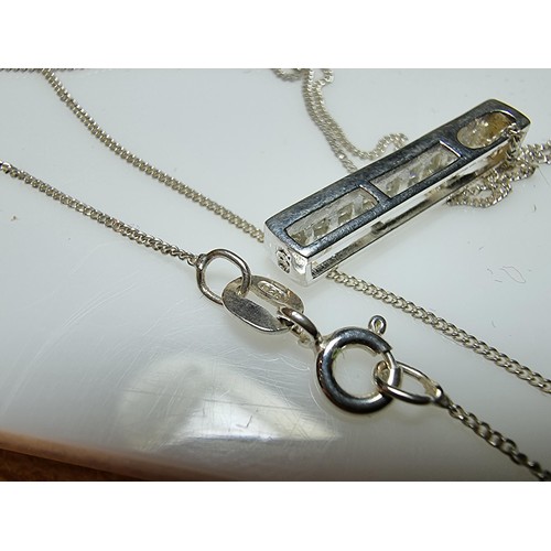 347 - A 925 silver bar pendant channel set with sparkly crystal CZ stones, set on an 18