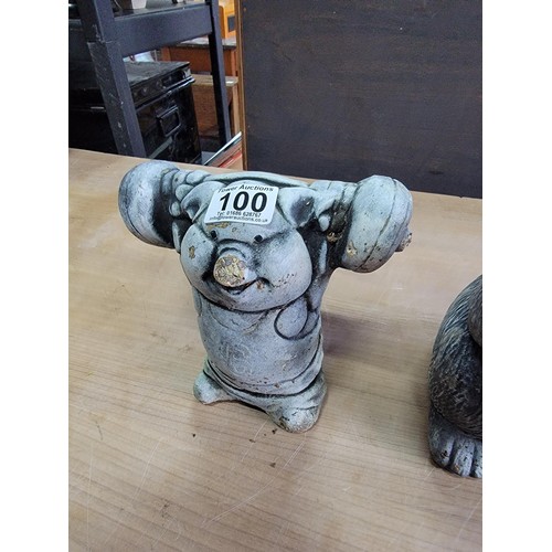 100 - Stoneware garden rabbit figure and pig figure lifting weights height of tallest piece 32cm