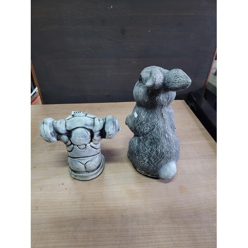 100 - Stoneware garden rabbit figure and pig figure lifting weights height of tallest piece 32cm