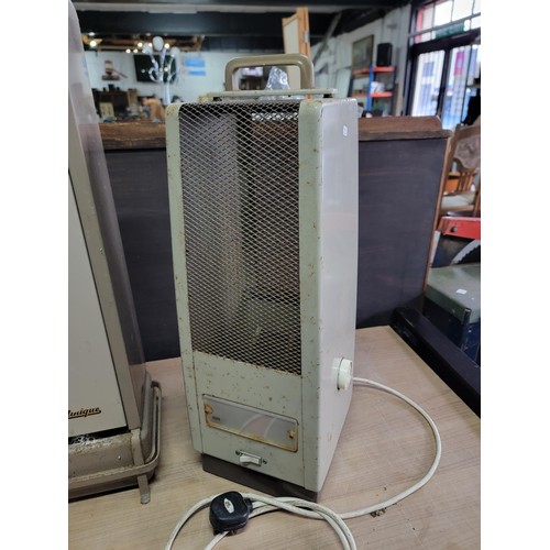 101 - Vintage Aladdin paraffin heater with fuel tank to the base along with a vintage Radiation Sun house ... 