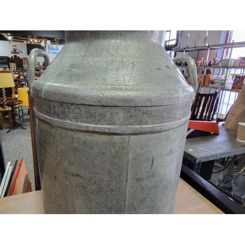 104 - Large 8 litre aluminium milk churn by Guineys Daries Ltd in good order complete with lid 81cm