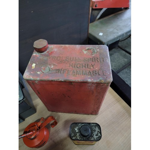 105 - Vintage red metal petrol can along with a Easing oil Shell can and a quantity of 4x vintage oil cans... 