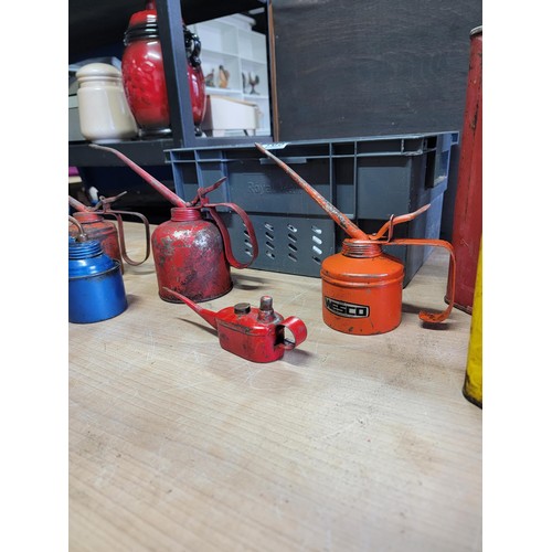 105 - Vintage red metal petrol can along with a Easing oil Shell can and a quantity of 4x vintage oil cans... 