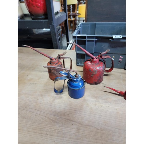 105 - Vintage red metal petrol can along with a Easing oil Shell can and a quantity of 4x vintage oil cans... 