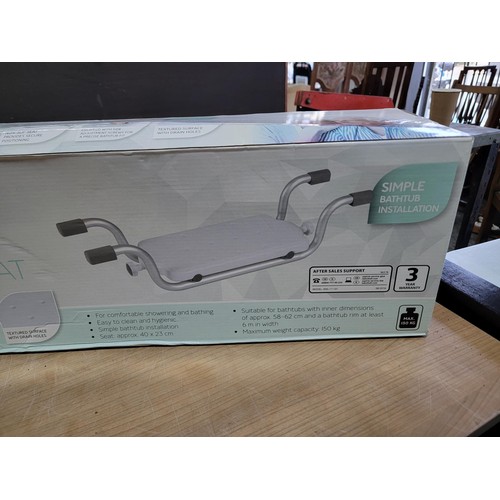 107 - Boxed silvercrest steam cleaner with accessories along with a boxed bath tub seat as new