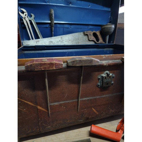 136 - Large metal chest containing a quantity of tools inc saw, wrench, blow torch cap, spanners, screwdri... 