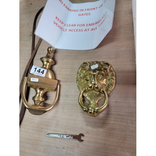 144 - 2x brass door knockers inc a lion mask along with a quantity of chains and dog chains