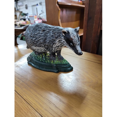 200 - 2x cast iron door stops inc a duck and badger, in good condition well painted height of largest is 3... 