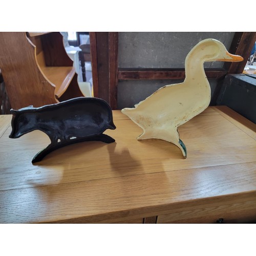 200 - 2x cast iron door stops inc a duck and badger, in good condition well painted height of largest is 3... 