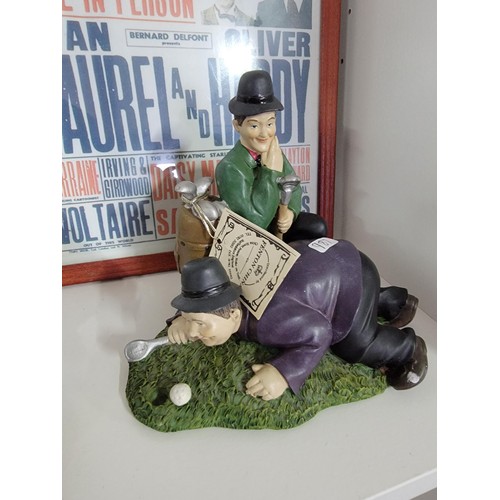 201 - A quantity of Laurel and Hardy figures, some made by Global 4 in total along with a reproduction emp... 