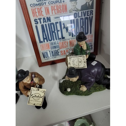 201 - A quantity of Laurel and Hardy figures, some made by Global 4 in total along with a reproduction emp... 