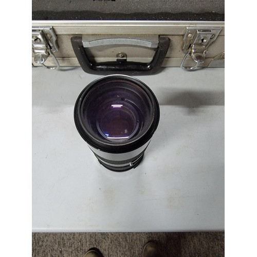 20 - Aluminium padded case containing a Zenith 11 SLR camera a Saitex lens and a Tamron lens all in good ... 