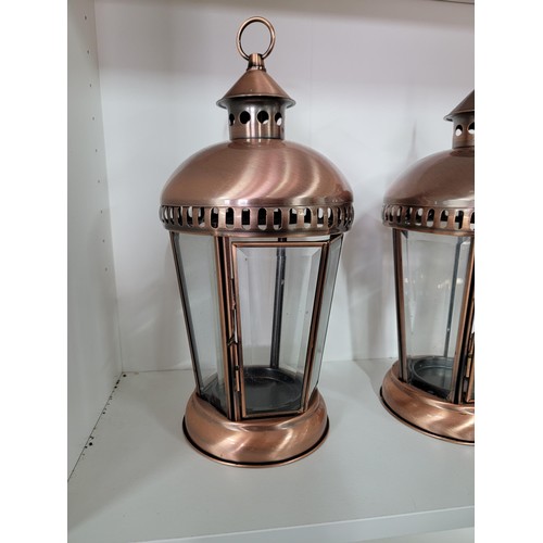 207 - 3x decorate copper effect candle lanterns with bevelled glass inserts in good order height of 37cm