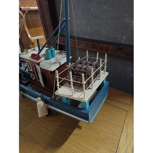 209 - Collectable trawler complete with rigging and acessories in good order measures 38cm high by 46cm hi... 