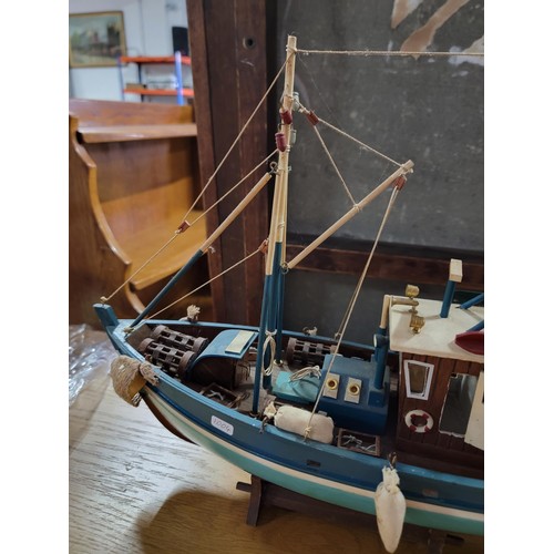 209 - Collectable trawler complete with rigging and acessories in good order measures 38cm high by 46cm hi... 