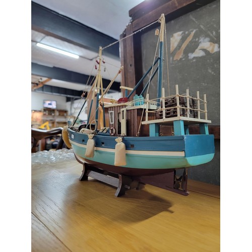 209 - Collectable trawler complete with rigging and acessories in good order measures 38cm high by 46cm hi... 