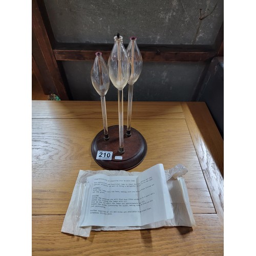 210 - An unused Bridale lamp which features 3 hand blown glass stems, featuring fibre wicks which are to b... 