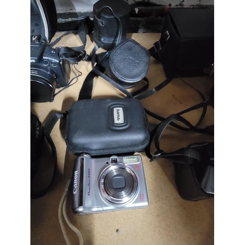 23 - Quantity of cameras and accessories inc 5x cameras inc Canon Powershot A460, Ricoh KR-10M, Canon Pow... 