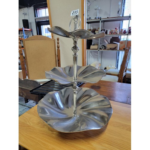 215 - 3 tier chrome cake and sandwich stand centre piece, in excellent condition height of 62cm diameter 4... 