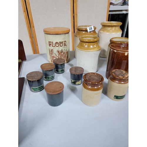 29 - 13x earthenware spice pots some with lids along with 4x earthen ware storage pots, a brown glaze lid... 