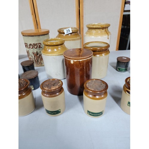 29 - 13x earthenware spice pots some with lids along with 4x earthen ware storage pots, a brown glaze lid... 