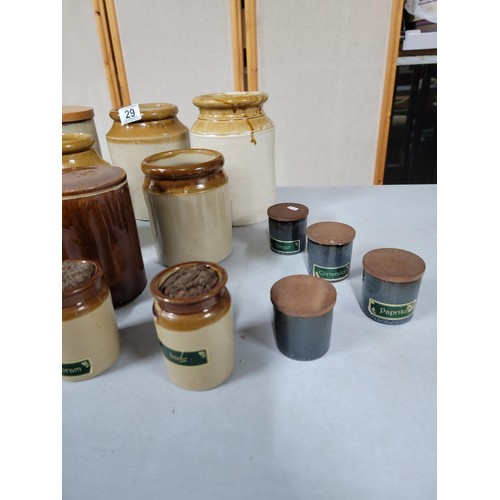 29 - 13x earthenware spice pots some with lids along with 4x earthen ware storage pots, a brown glaze lid... 