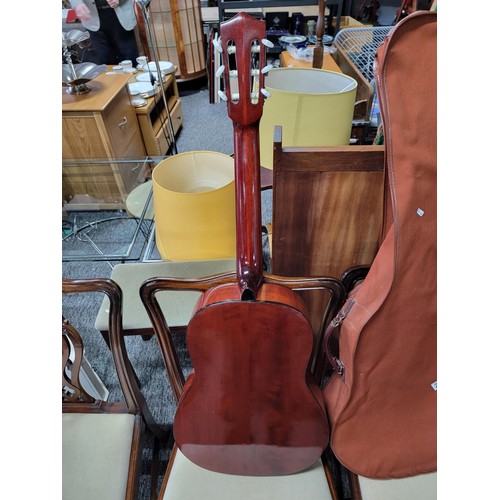 216 - A full size classical guitar in gig bag, in good condition.