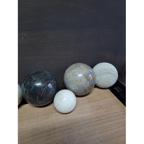 218 - Collection of large impressive genuine polished marble balls with one being a volcanic pummice, in g... 