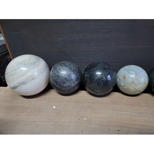 218 - Collection of large impressive genuine polished marble balls with one being a volcanic pummice, in g... 