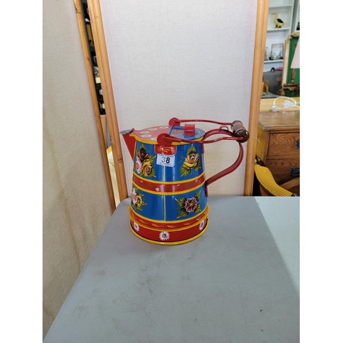 38 - A metal barge ware lidded water jug with a pretty floral design in good condition stands at 26cm hig... 