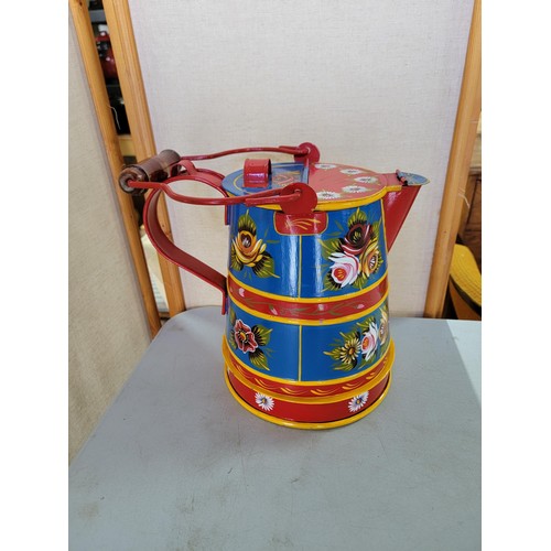 38 - A metal barge ware lidded water jug with a pretty floral design in good condition stands at 26cm hig... 