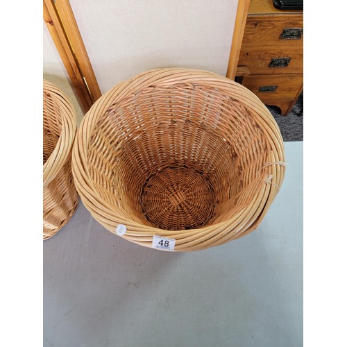 48 - 2x log/ linen wicker baskets in good order largest measures 34.5 cm high 46cm diameter