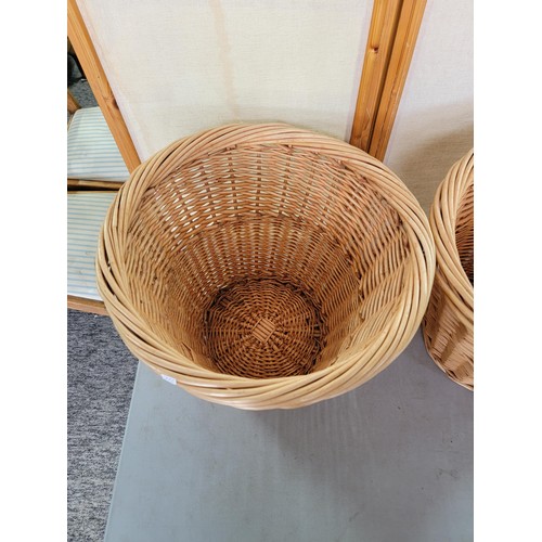 48 - 2x log/ linen wicker baskets in good order largest measures 34.5 cm high 46cm diameter