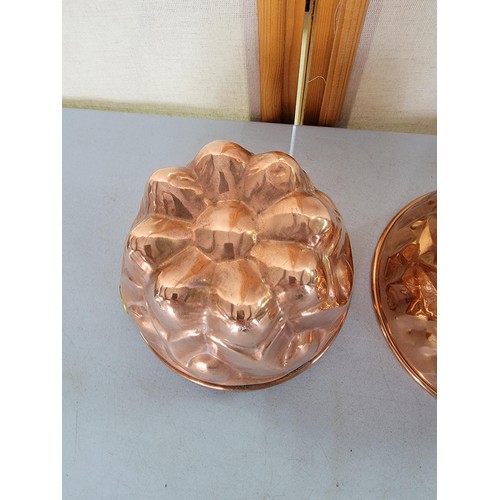 49 - 2x copper Rowntrees jelly moulds one with a plaque largest mesures 9.5cm high by 17cm diameter