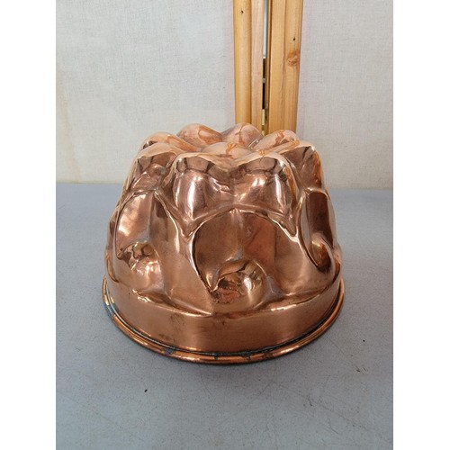 49 - 2x copper Rowntrees jelly moulds one with a plaque largest mesures 9.5cm high by 17cm diameter