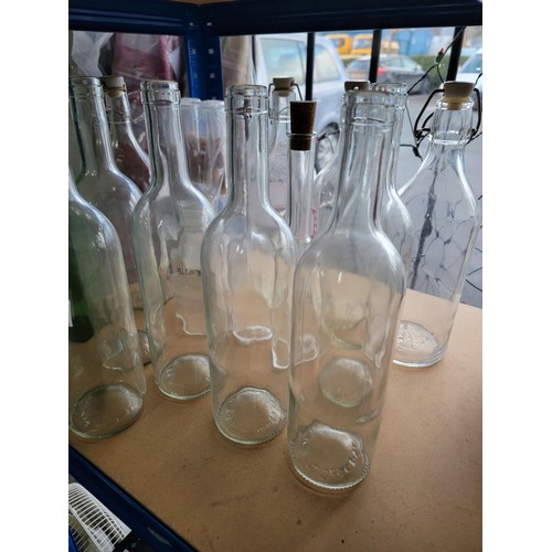 64 - A large selection of 20x glass bottles some including stoppers, inc 6x as new olive oil bottles with... 