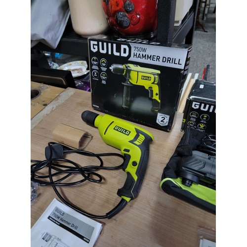 173 - 3x tools inc a Guild 750w hammer drill comes with an unopened bag containing handle and depth measur... 