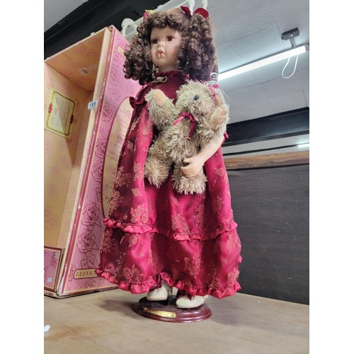 189 - Soft expression hand painted porcelain doll in red dress holding a teddy bear from the series of Dan... 