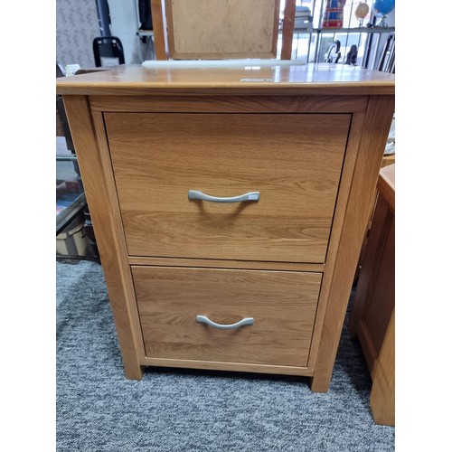 501 - A modern solid light oak filing cabinet with 2 drawers with metal handles containing a quantity of d... 