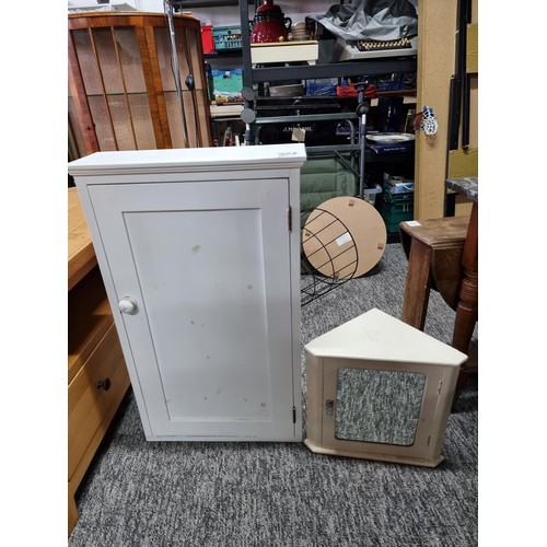 503 - A small vintage bathroom corner cabinet with bevel edged mirror along with a larger bathroom cabinet... 