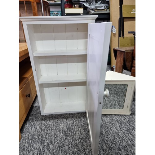 503 - A small vintage bathroom corner cabinet with bevel edged mirror along with a larger bathroom cabinet... 