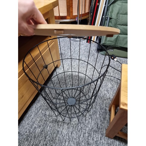 504 - Metal cage linen basket a clean small solid light oak table and a chrome pebble stem table lamp and ... 