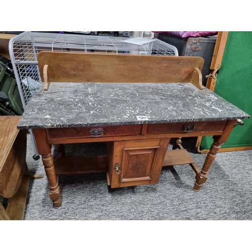 510 - Antique solid mahogany wash stand with a solid marble top featuring two drawers and one cupboard wit... 