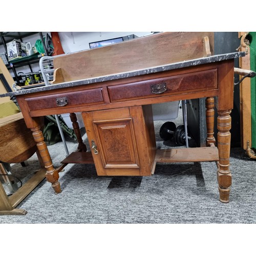 510 - Antique solid mahogany wash stand with a solid marble top featuring two drawers and one cupboard wit... 