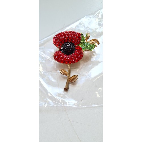 340C - The Royal British Legion gilt metal poppy brooch with a black, red and clear jewelled design which a... 