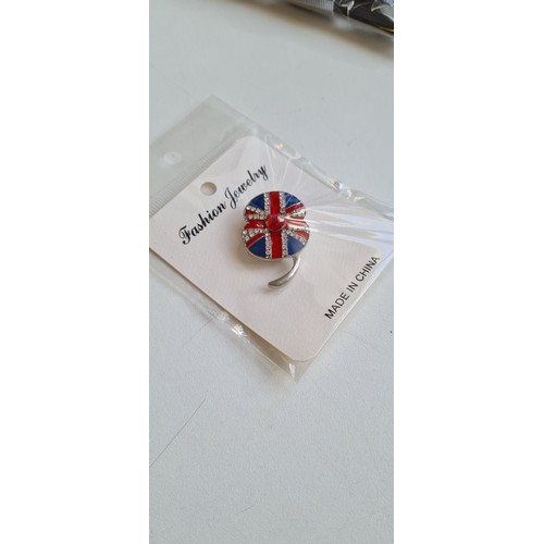 340D - Union Jack enameled poppy brooch with a red and clear jeweled design which are sparkly and lively ne... 