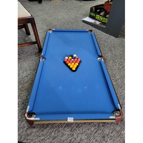 99 - Blue collapsible pool table with blue cloth legs need attention along with a triangle and quantity o... 