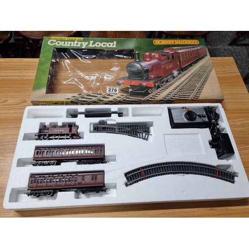 276 - A boxed Hornby R671 country local trainset tank locomotive of 2 matching clerestory coaches, oval an... 