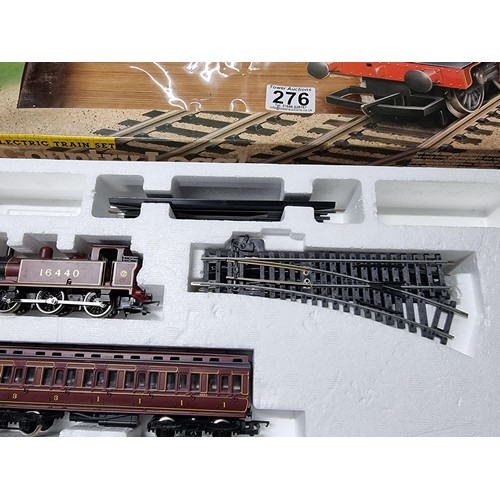 276 - A boxed Hornby R671 country local trainset tank locomotive of 2 matching clerestory coaches, oval an... 