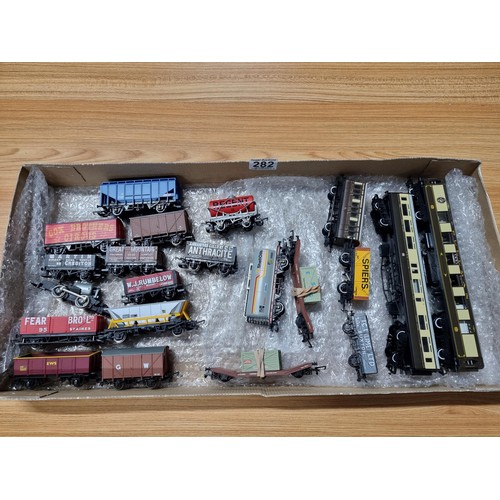 282 - A cardboard tray containing 20x Hornby rolling stock to include GWR restaurant coach, brand new Pull... 